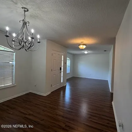 a view of a livingroom with wooden floor