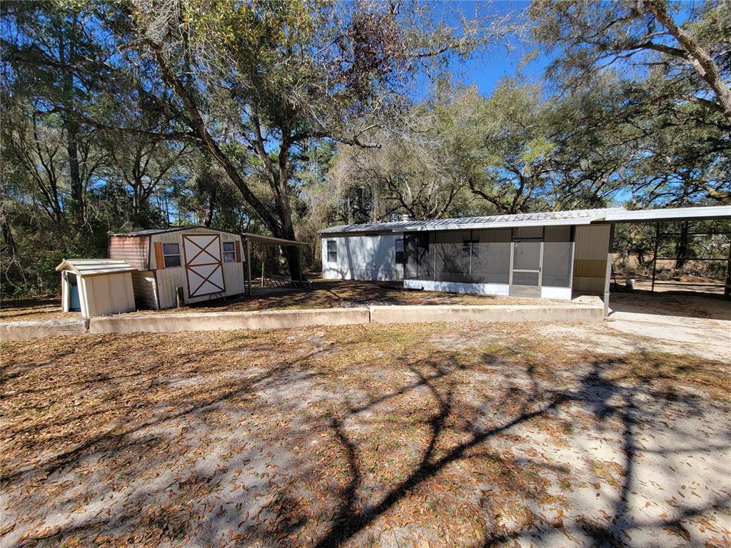 a view of street with large trees