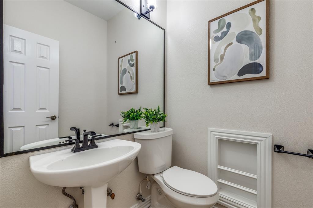 4037 Azure Lane Addison, TX 75001 - Photo 13 of 36 Half bathroom featuring toilet and a textured wall