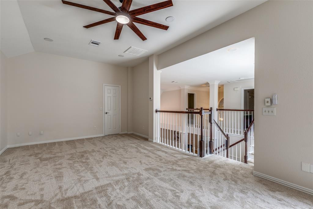 4037 Azure Lane Addison, TX 75001 - Photo 16 of 36 Empty room with light carpet and ceiling fan
