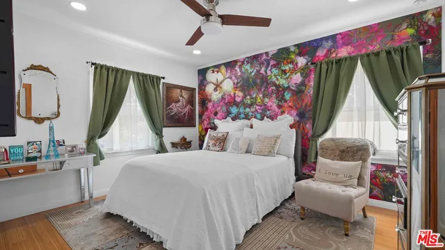 a bedroom with a bed and a couch