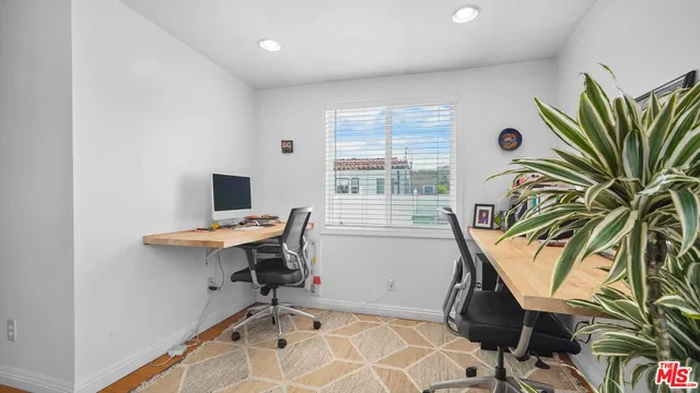 a view of a workspace with furniture