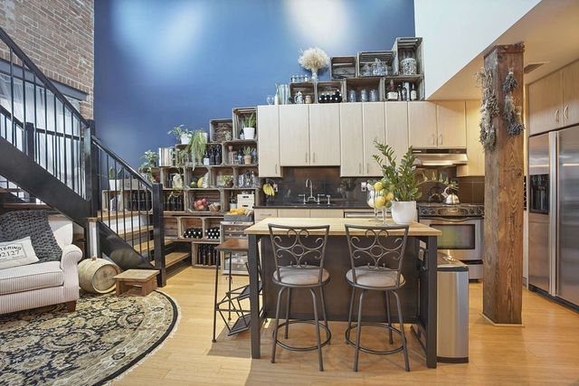 a living room with lots of furniture and a dining table