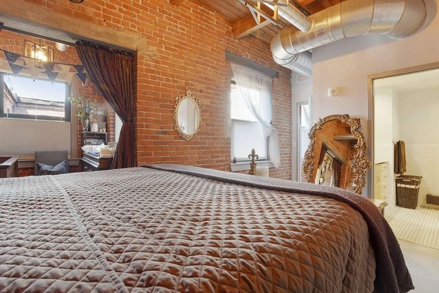 a view of a balcony with furniture