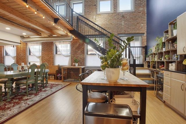 a view of a kitchen with furniture and a kitchen