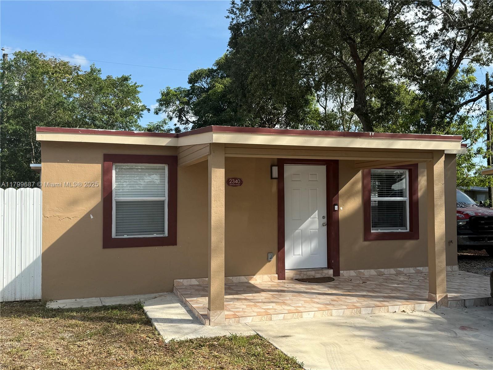 2340 Service Road Opa-Locka, FL 33054 - Photo 1 of 29 a front view of a house