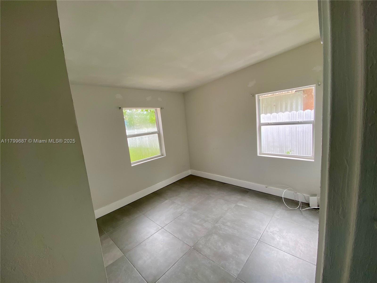 2340 Service Road Opa-Locka, FL 33054 - Photo 11 of 29 an empty room with a window
