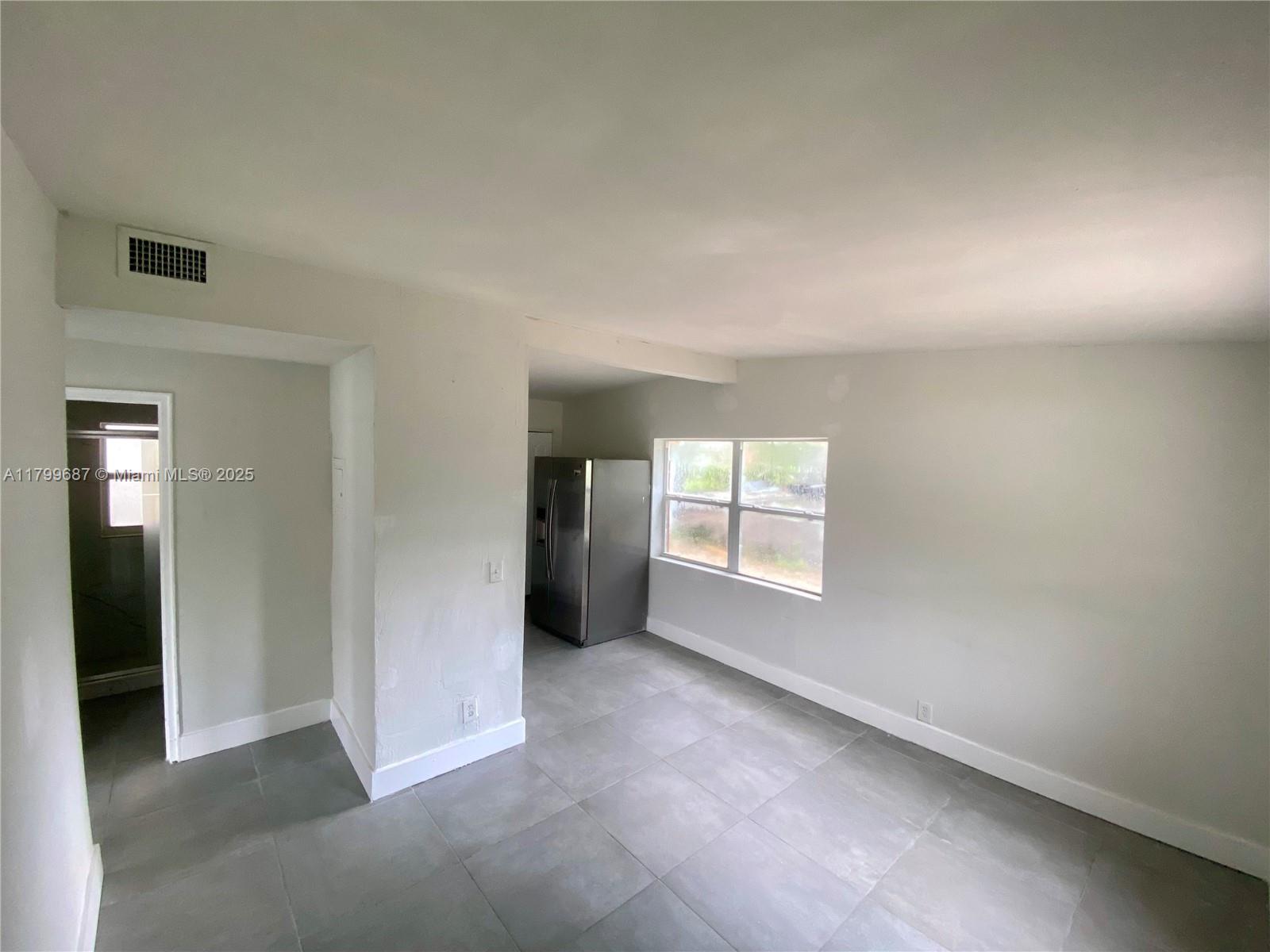 2340 Service Road Opa-Locka, FL 33054 - Photo 4 of 29 an empty room with windows and closet
