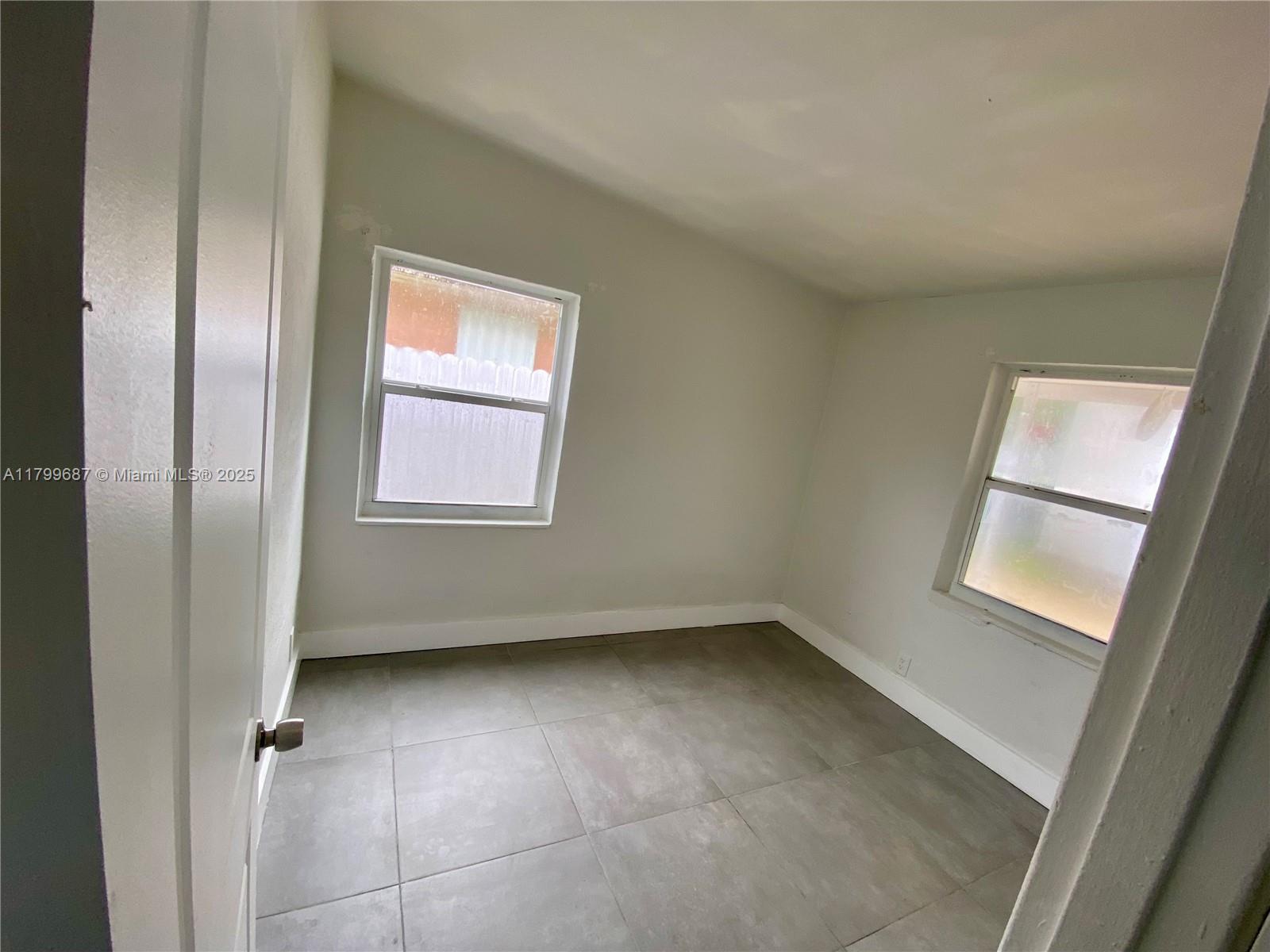 2340 Service Road Opa-Locka, FL 33054 - Photo 10 of 29 a view of an empty room with a window