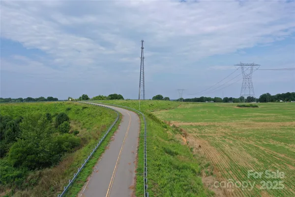 a view of a field with an ocean