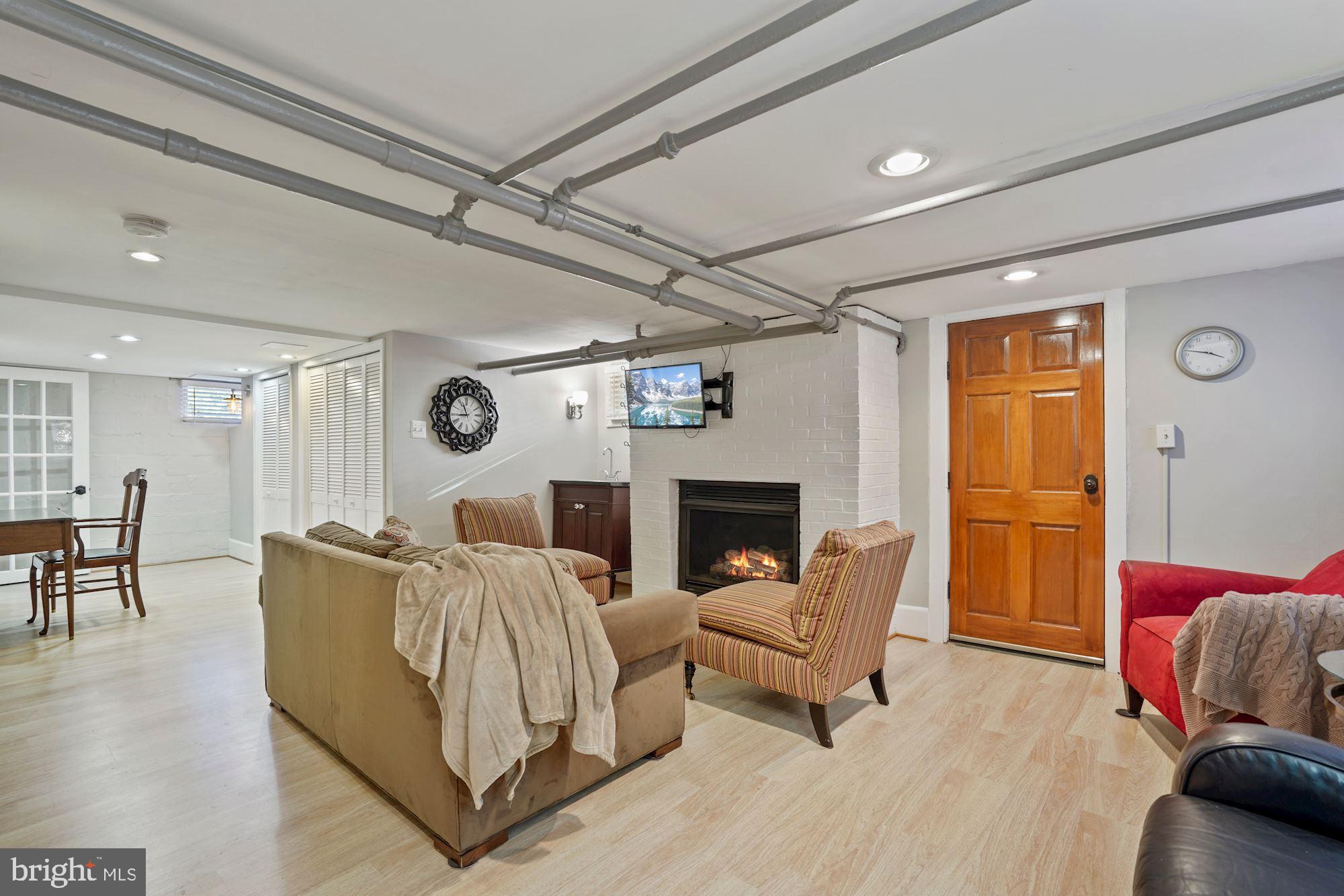 3320 2nd Road North Arlington, VA 22201 - Photo 20 of 31 LL rec room with cozy gas fireplace and sink