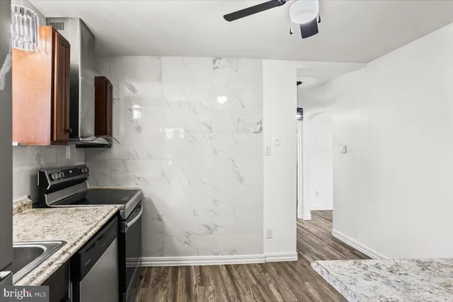 a kitchen with a refrigerator and a sink