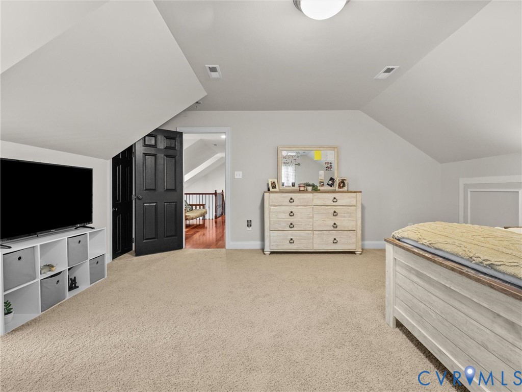 12710 Ivey Mill Road Chesterfield, VA 23838 - Photo 47 of 57 Carpeted flooring with sloped ceilings, a paneled
