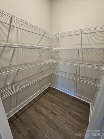 a view of a room with racks on the wall