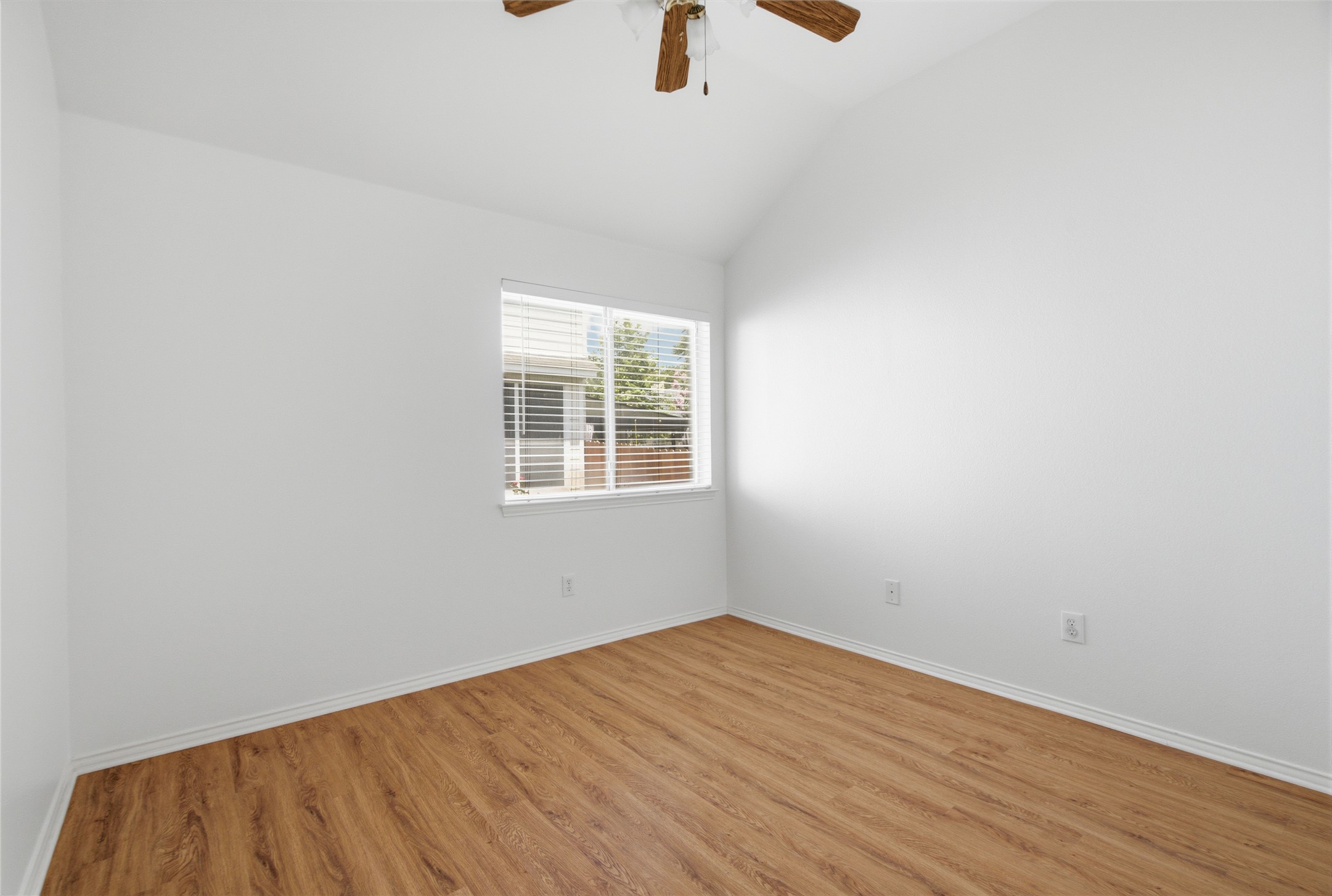 2920 Warwick Way Austin, TX 78748 - Photo 23 of 36 Secondary bedroom #2 features vaulted ceilings and rich wood-like flooring