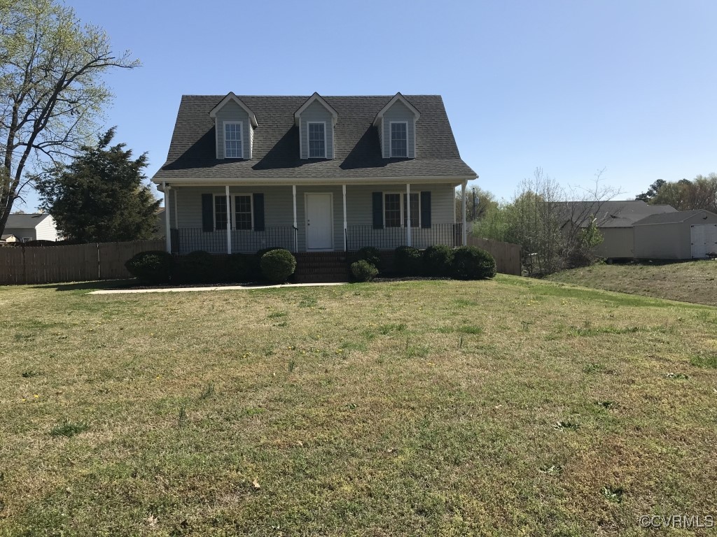 7235 Hopkins Road Richmond, VA 23237 - Photo 1 of 14 a front view of a house with a yard