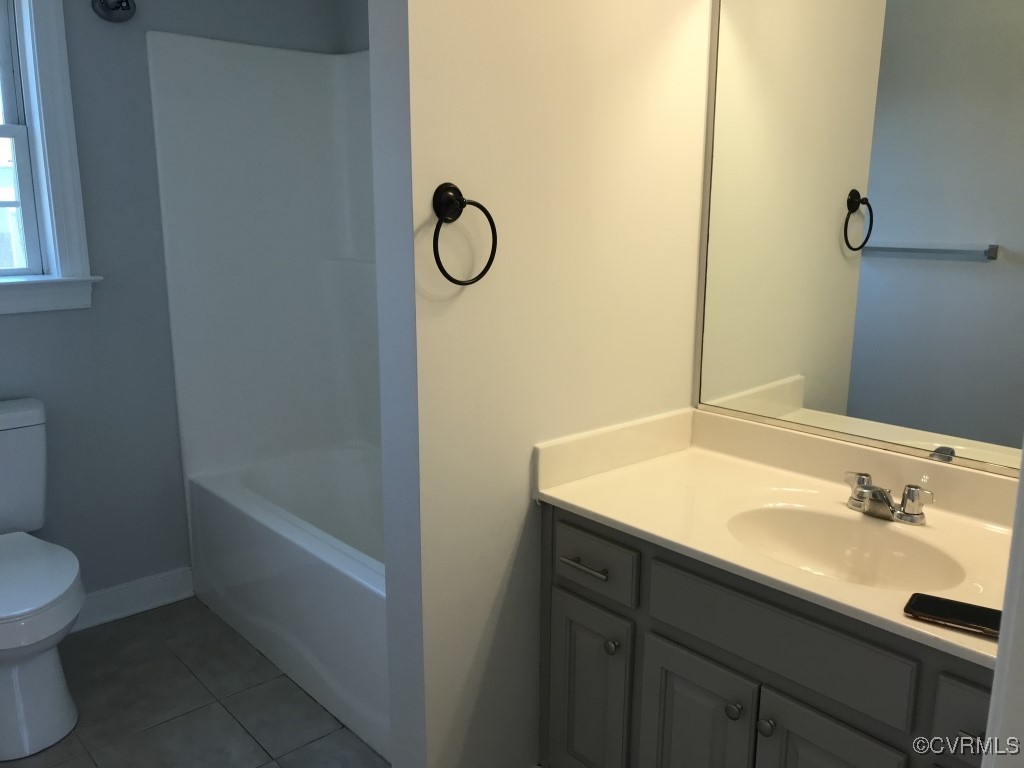 7235 Hopkins Road Richmond, VA 23237 - Photo 12 of 14 a bathroom with a sink and a mirror
