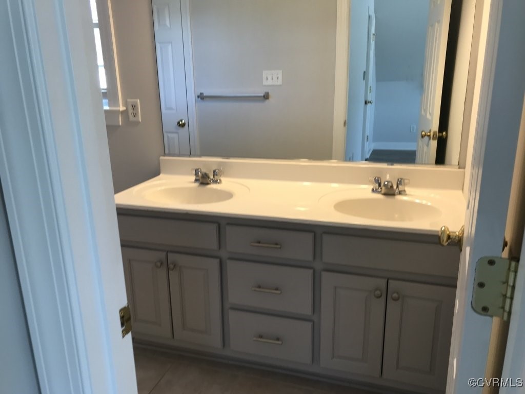 7235 Hopkins Road Richmond, VA 23237 - Photo 13 of 14 a bathroom with a sink and a mirror