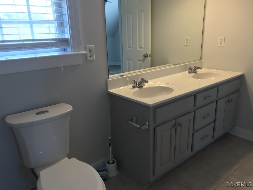7235 Hopkins Road Richmond, VA 23237 - Photo 8 of 14 a bathroom with a toilet sink and mirror