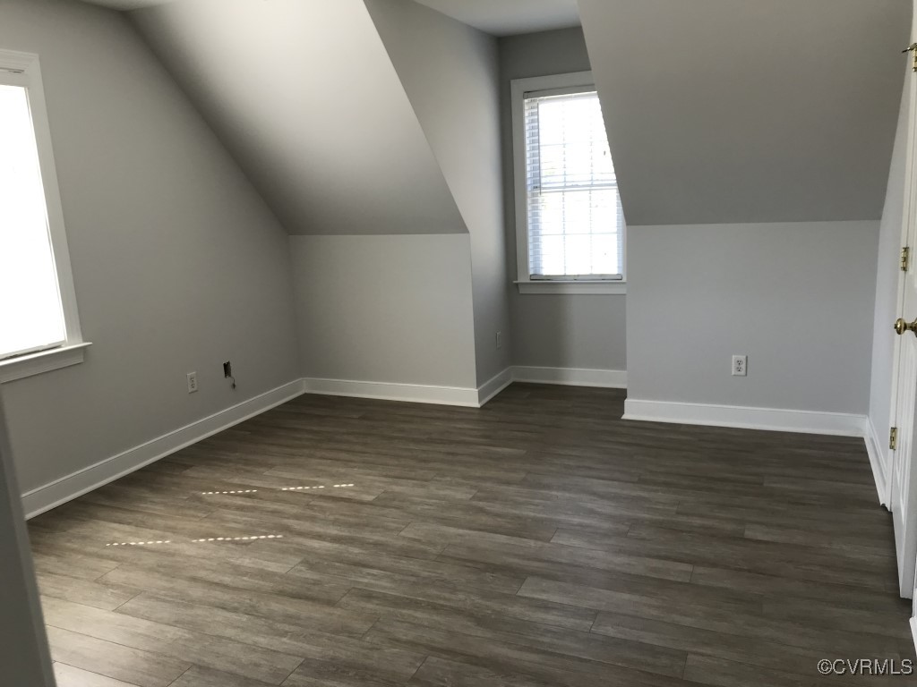 7235 Hopkins Road Richmond, VA 23237 - Photo 9 of 14 an empty room with wooden floor and windows