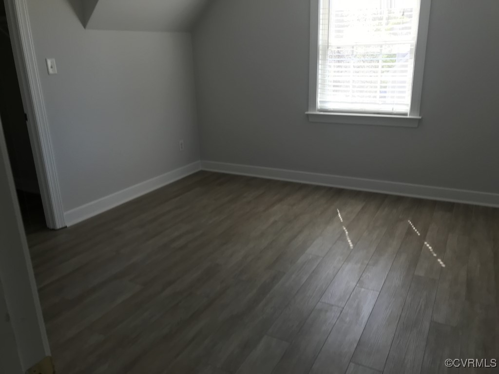 7235 Hopkins Road Richmond, VA 23237 - Photo 10 of 14 an empty room with wooden floor and windows