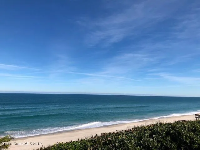 a view of a balcony with wooden floor