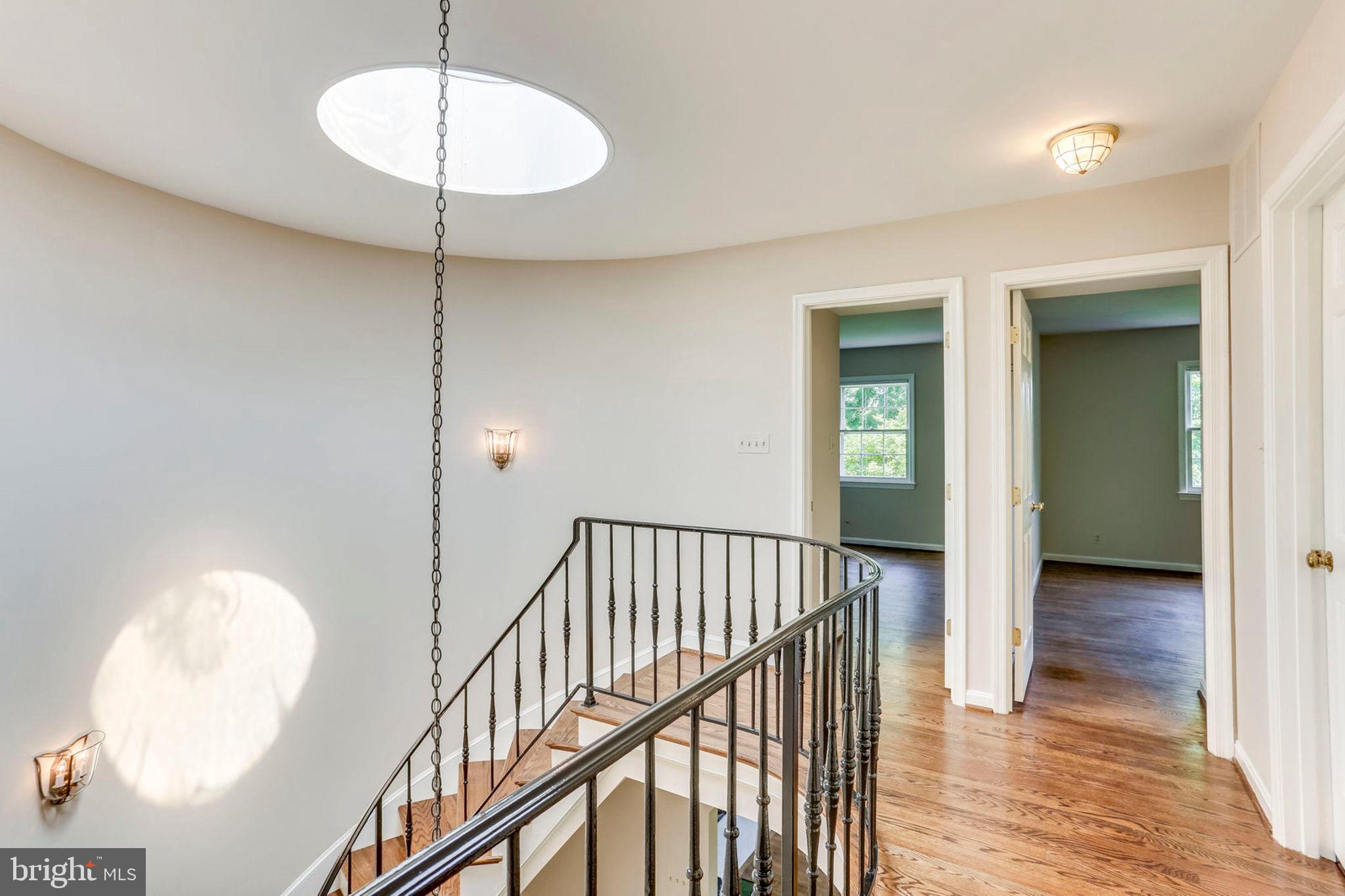 2307 North Glebe Road Arlington, VA 22207 - Photo 31 of 35 Occulus provides light down beauful curves stairs