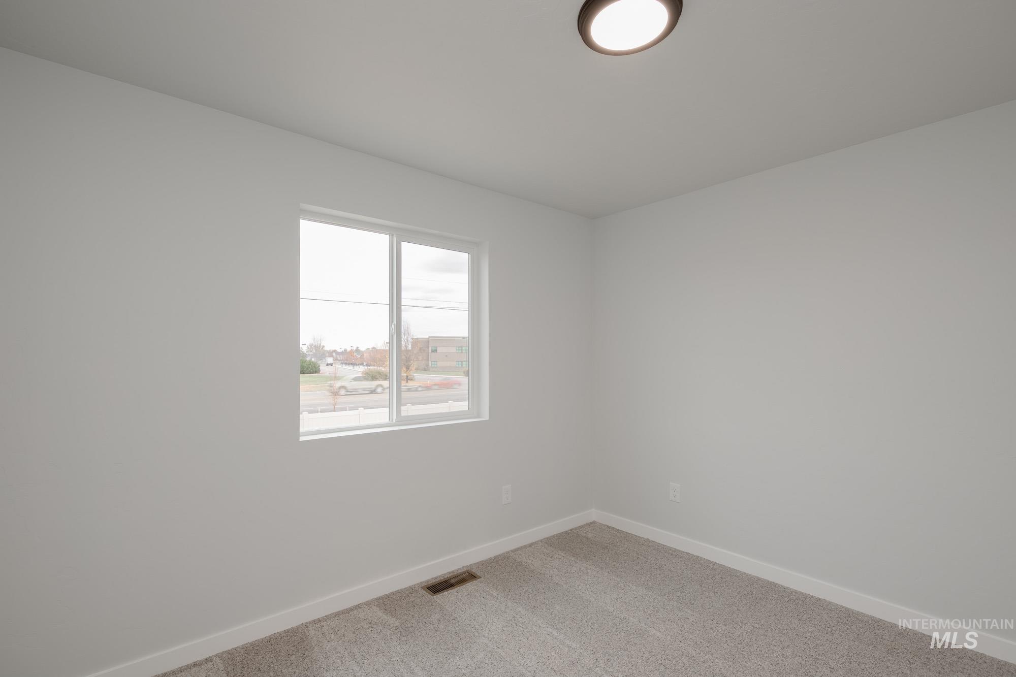 3005 South Maple Rnch Way Nampa, ID 83686 - Photo 22 of 25 Carpeted spare room featuring baseboards
