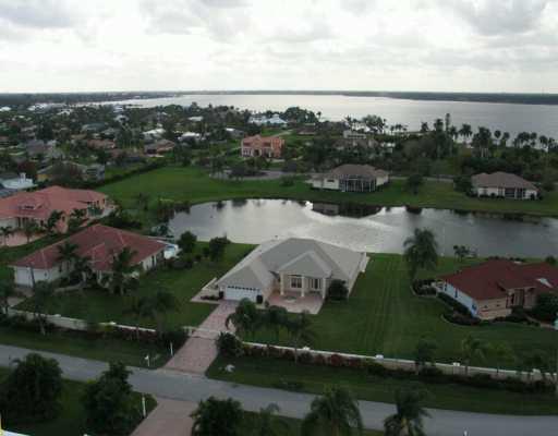 105 Northwest S Shore Road Stuart, FL 34994 - Photo 1 of 8 an aerial view of a house with a lake view
