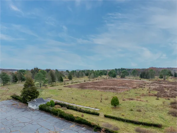 a view of a field with trees