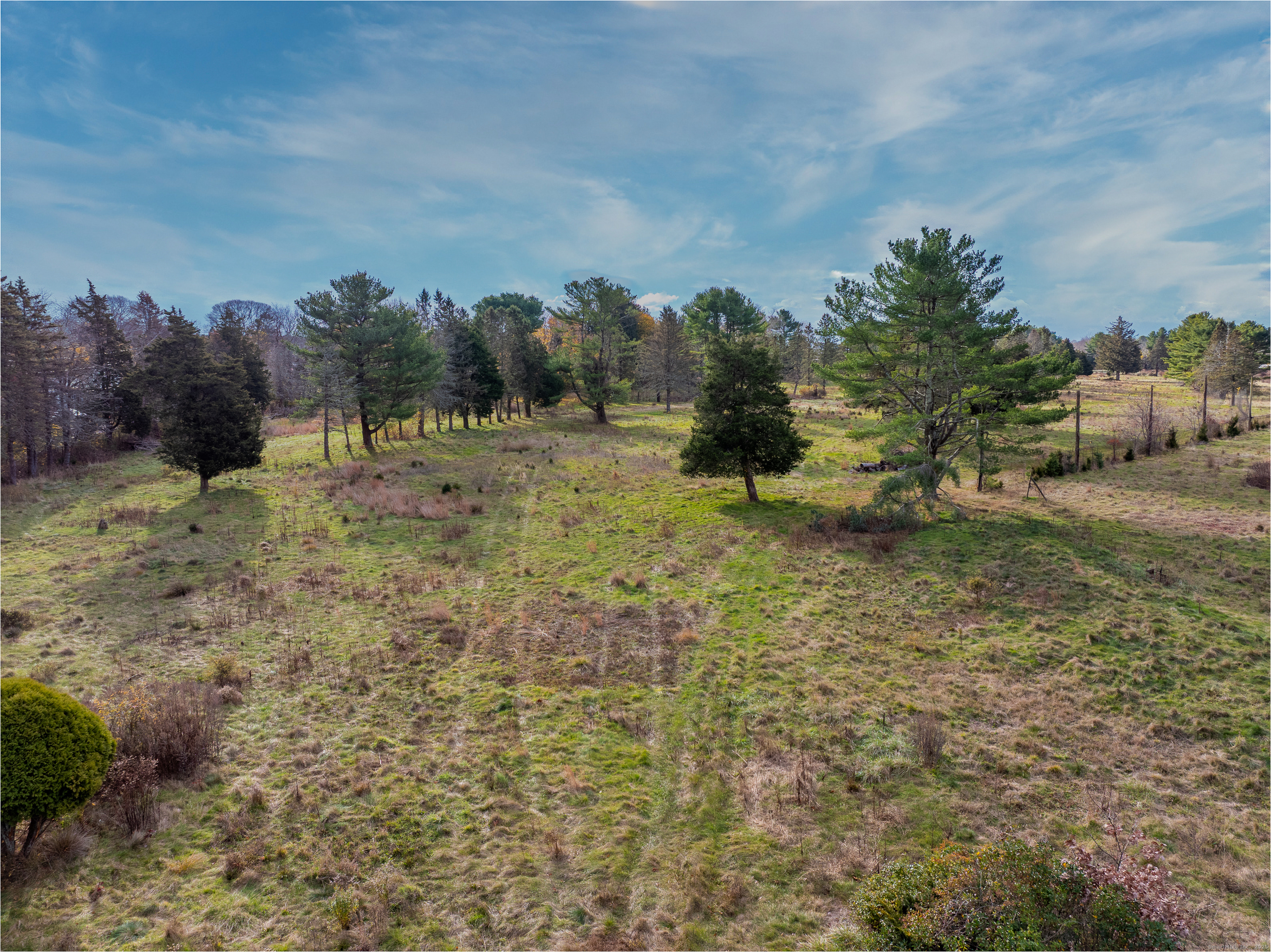 119 High Rock Road Groton, CT 06340 - Photo 5 of 22 a view of a field with trees in the background