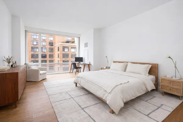 a kitchen with sink a stove and wooden floor