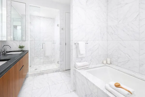 a spacious bedroom with a bed and a large window