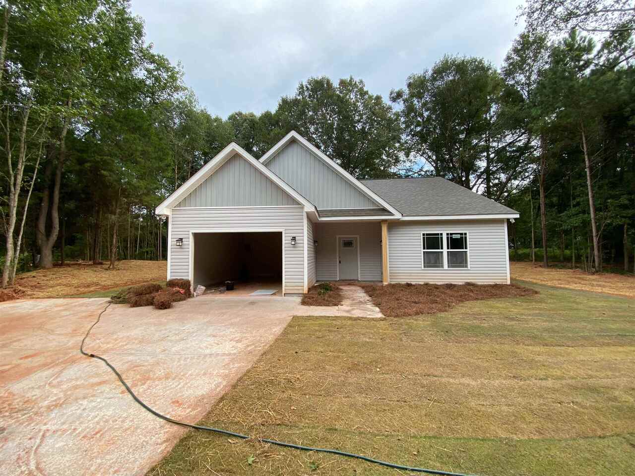 640 Zebulon Road Milner, GA 30257 - Photo 1 of 1 a view of house with yard and trees in the background
