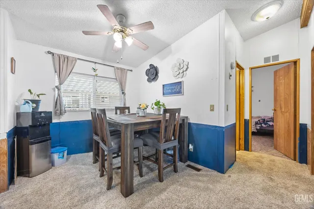 a dining room with furniture window and wooden floor