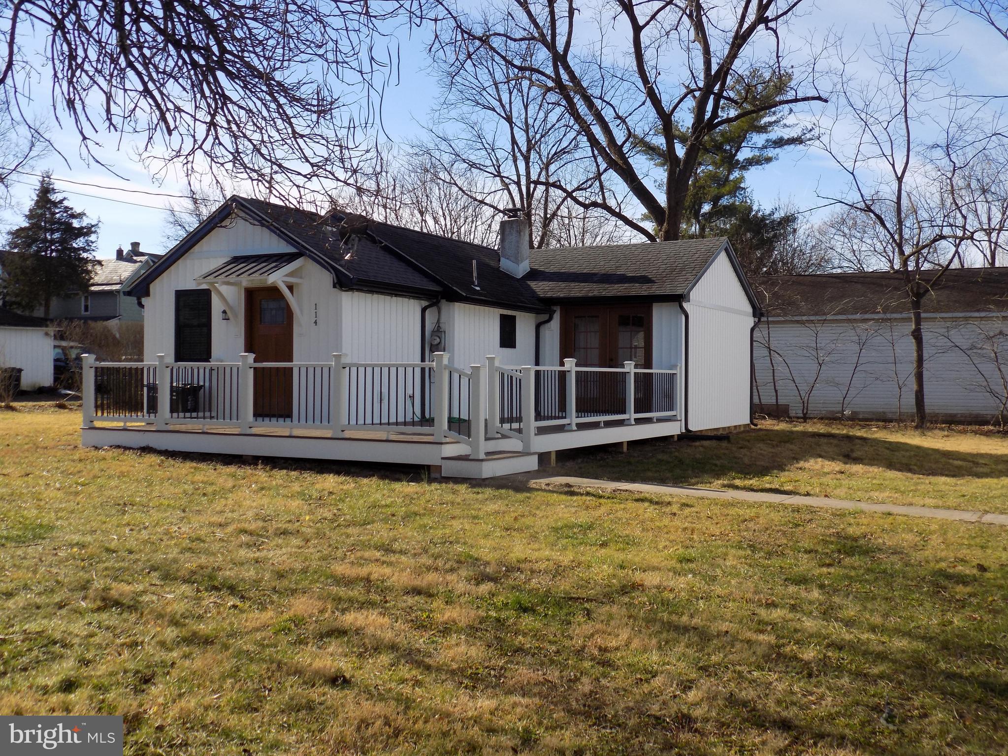 a house that has a large pool in front of it