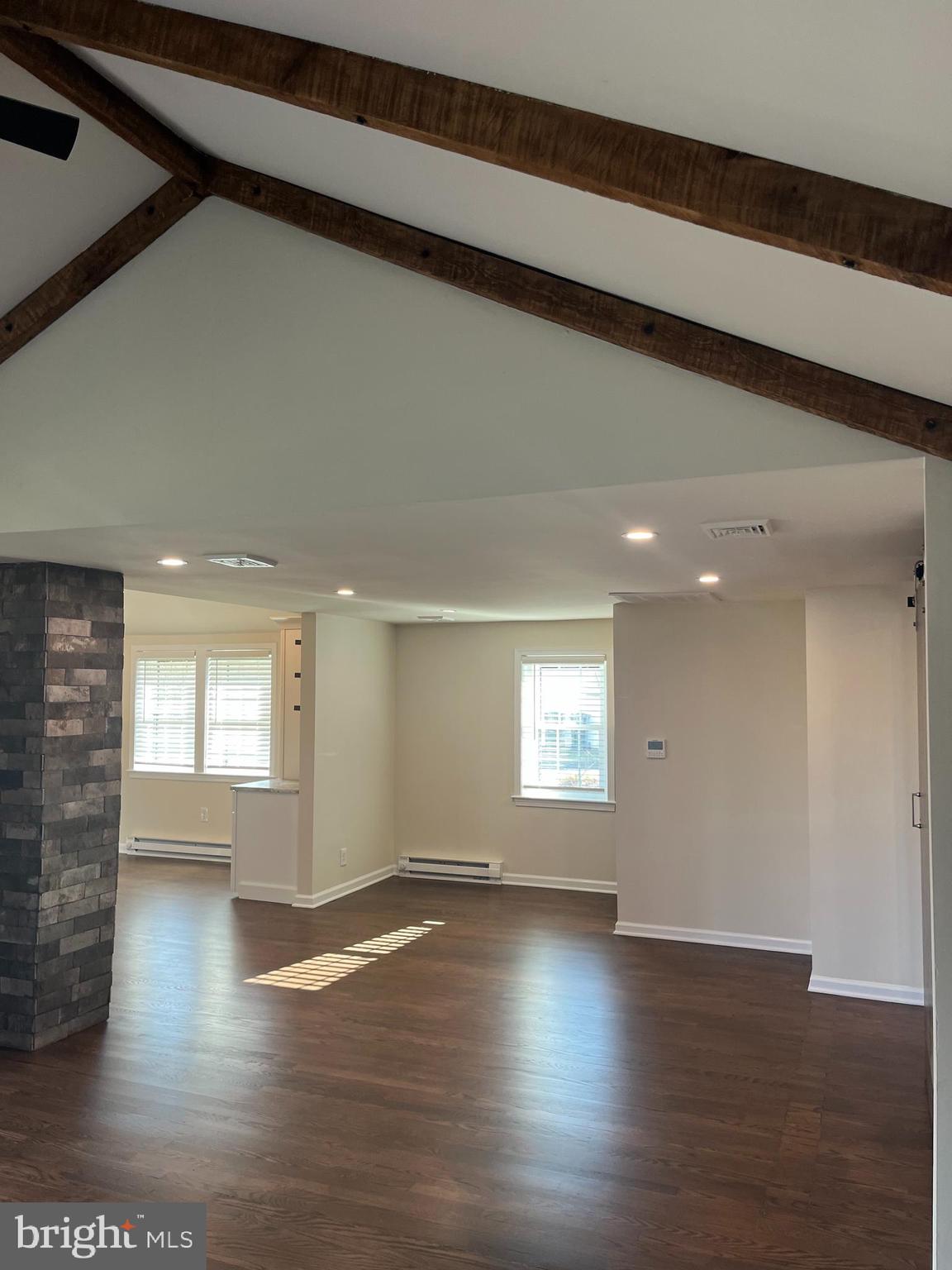 114 North Penrose Street Quakertown, PA 18951 - Photo 12 of 25 an empty room with wooden floor and windows