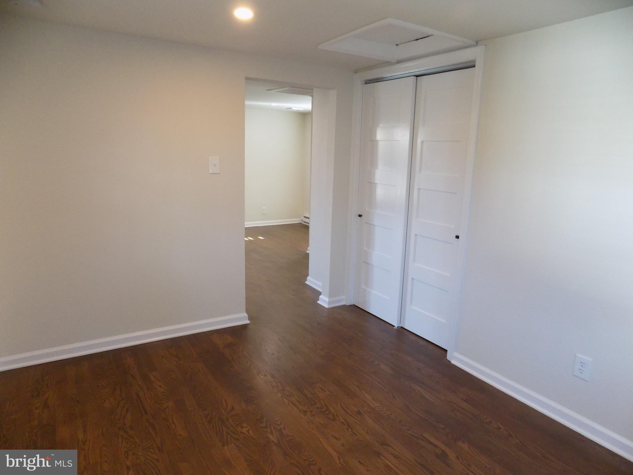114 North Penrose Street Quakertown, PA 18951 - Photo 16 of 25 a view of an empty room with wooden floor