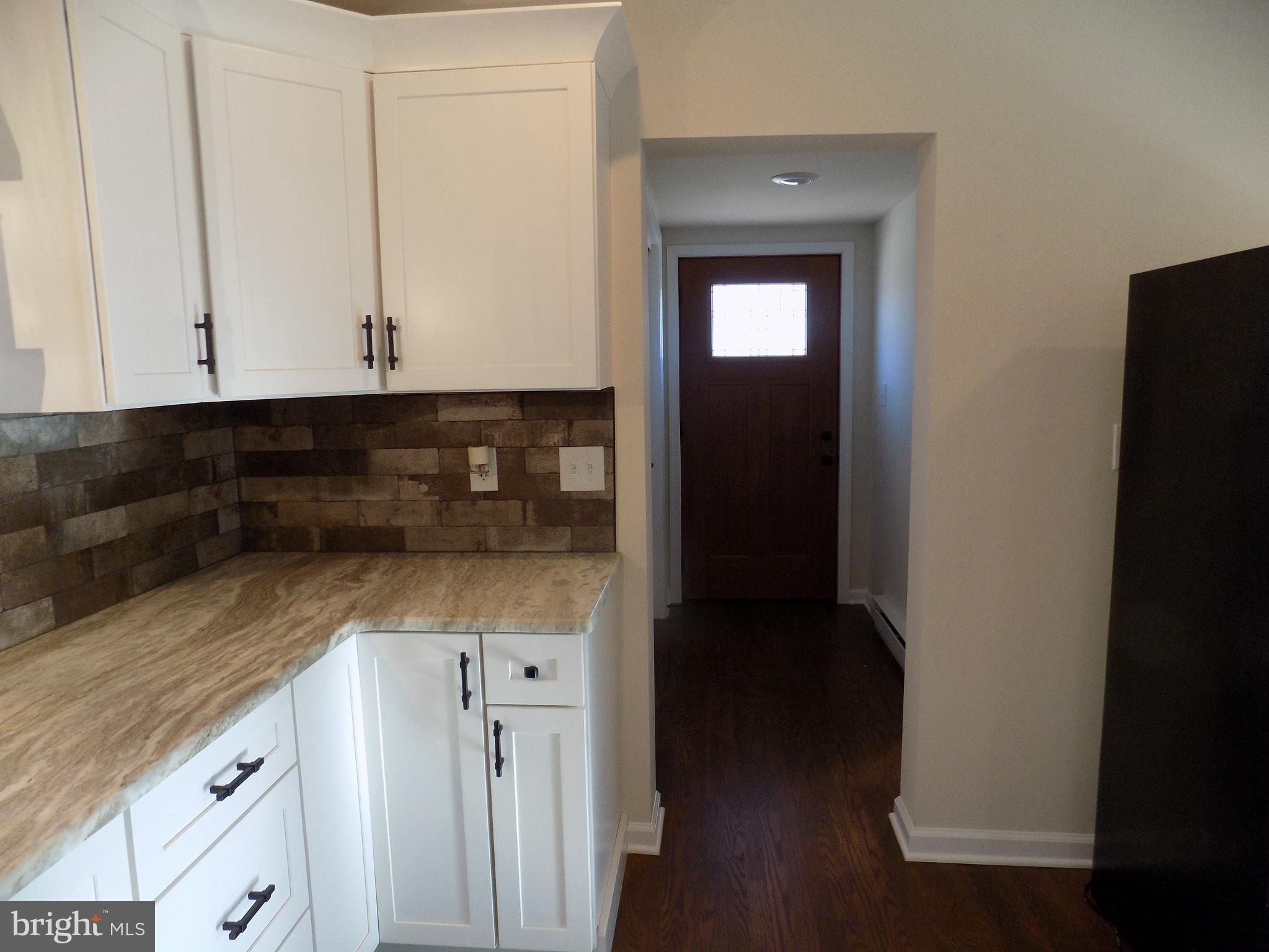 114 North Penrose Street Quakertown, PA 18951 - Photo 4 of 25 a view of cabinets and wooden floor