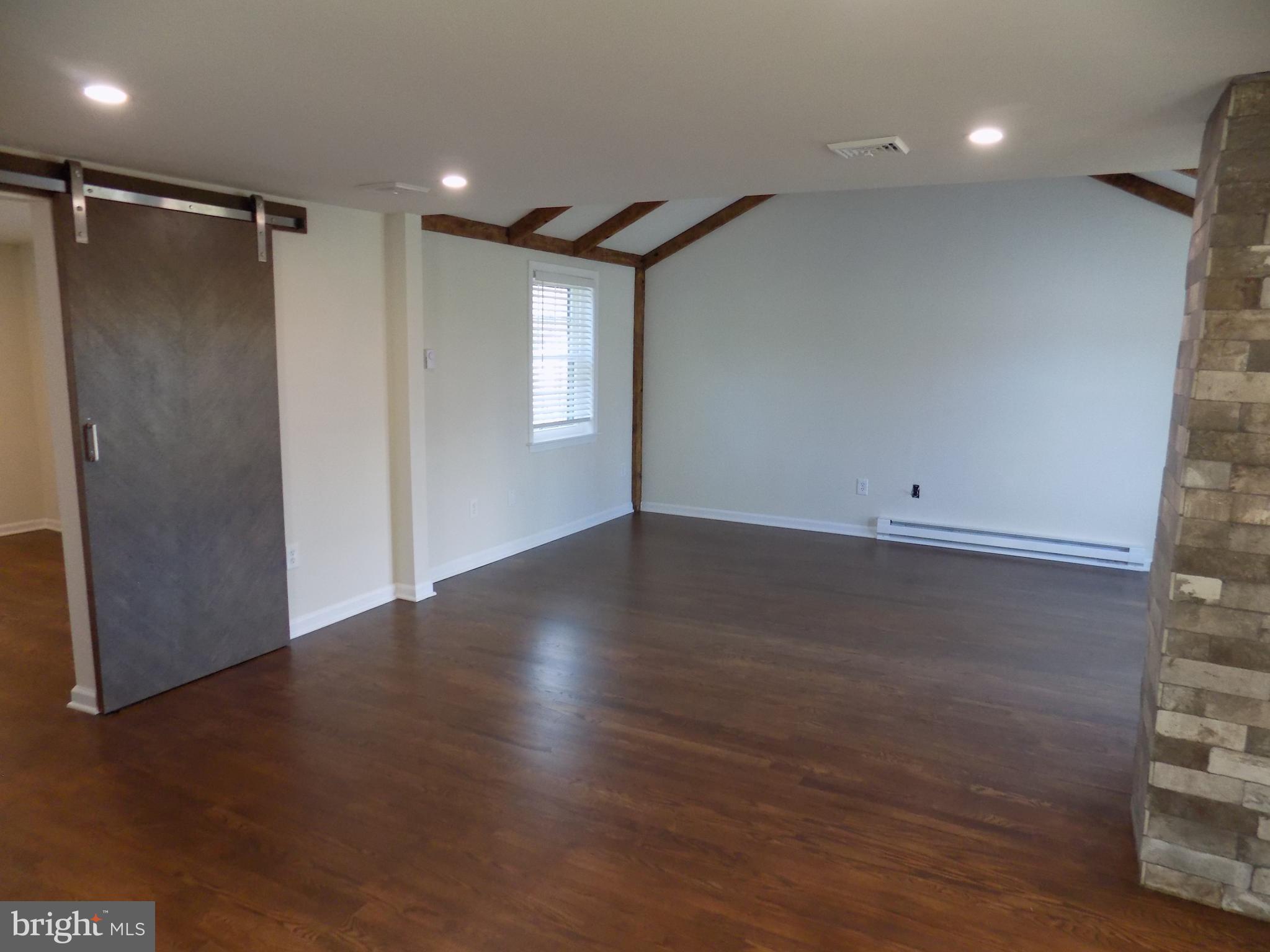 114 North Penrose Street Quakertown, PA 18951 - Photo 7 of 25 a view of room with window and wooden floor