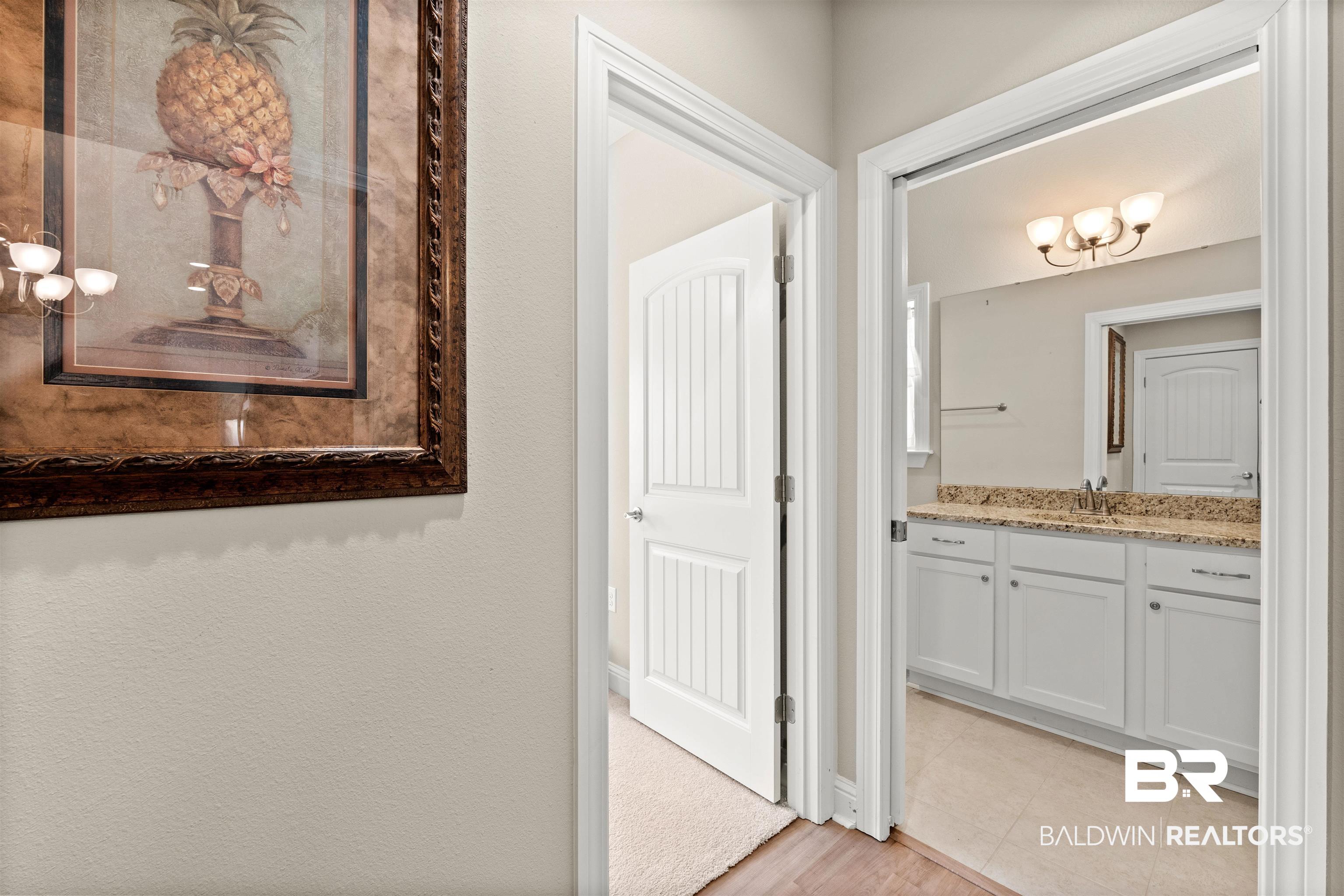 301 Holmes Avenue, Unit 301 Foley, AL 36535 - Photo 28 of 54 Bathroom featuring tile patterned flooring and vanity