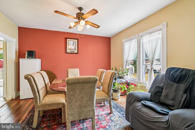 a work room with furniture and a large window