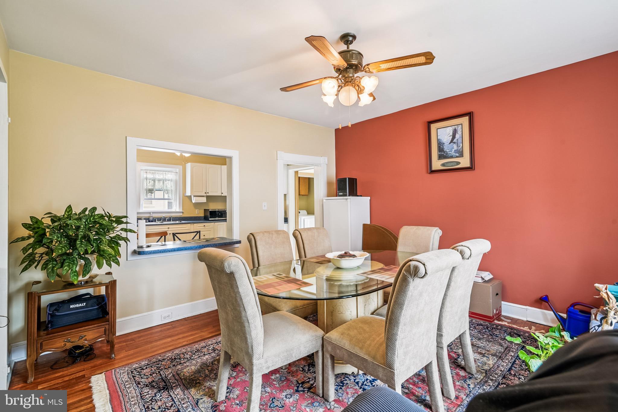 16 Columbia Avenue Crisfield, MD 21817 - Photo 13 of 36 a dining room with furniture potted plants and wooden floor