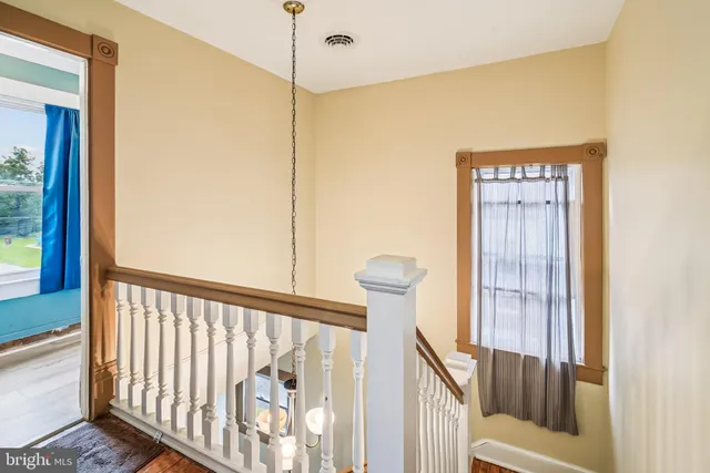 a view of a balcony with wooden floor
