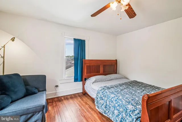 a bedroom with a large bed and a couch