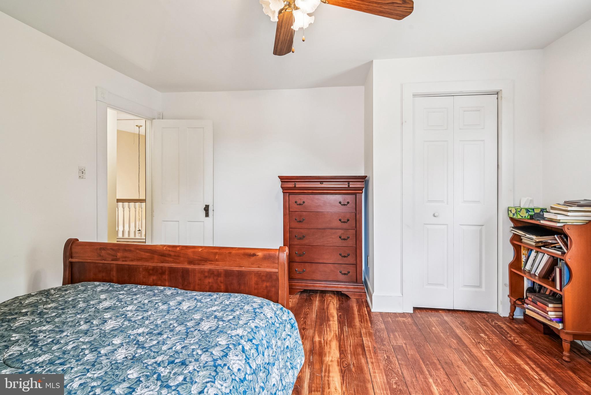 16 Columbia Avenue Crisfield, MD 21817 - Photo 24 of 36 a bedroom with a bed and wooden floor