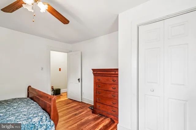 a living room with furniture and a air conditioner