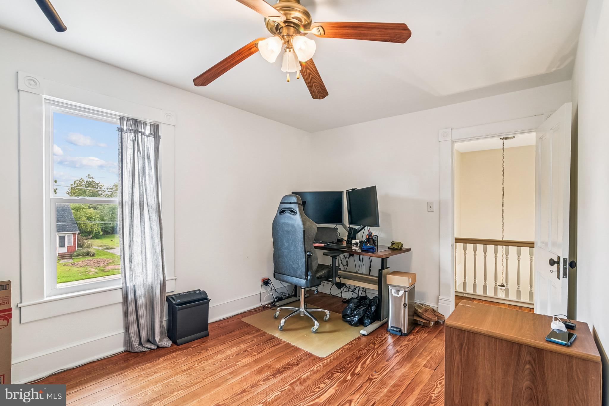 16 Columbia Avenue Crisfield, MD 21817 - Photo 28 of 36 a view of a workspace with furniture and a window