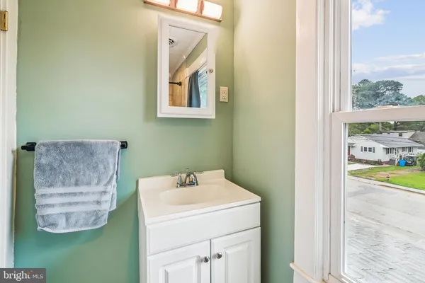 a view of a bathroom with shower and front door