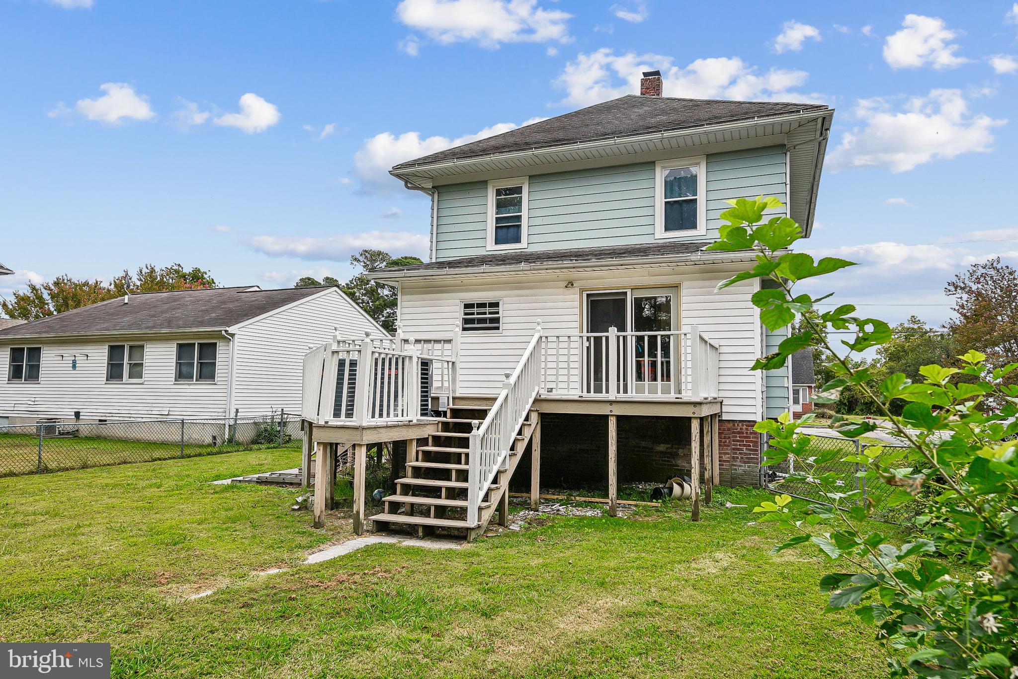 16 Columbia Avenue Crisfield, MD 21817 - Photo 33 of 36 a front view of a house with a yard